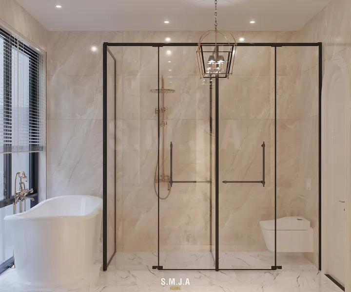 Thiết kế phòng tắm Master nhà phố 2 tầng với khu tắm kính khung kim loại, bồn tắm độc lập và đá vân mây.